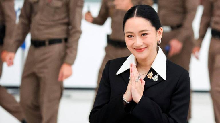 Suspended Thai Prime Minister Paetongtarn Shinawatra arrives at the Constitutional Court to testify in a high-profile ethics case, following a leaked phone conversation between her and Cambodia‚Äôs former leader Hun Sen, in Bangkok, Thailand, August 21, 2025. REUTERS/Athit Perawongmetha