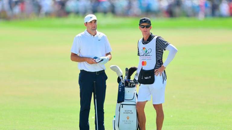 Scottie Scheffler and caddie Ted Scott. Credit Getty Images