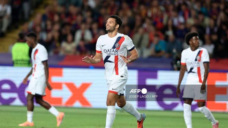Paris Saint-Germain's Portuguese forward #09 Goncalo Ramos (C) celebrates scoring their second goal during the UEFA Champions League league phase day 2 football match between FC Barcelona and Paris Saint-Germain (PSG) at the Estadi Olimpic Lluis Companys in Barcelona, on October 1, 2025. - AFP