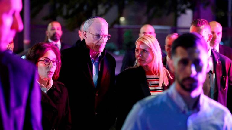 U.S. Attorney General Pam Bondi and Israeli Ambassador to the U.S. Yechiel Leiter visit the site where, according to the U.S. Homeland Security Secretary, two Israeli embassy staff were shot dead near the Capital Jewish Museum in Washington, D.C., U.S. May 22, 2025. REUTERSpix