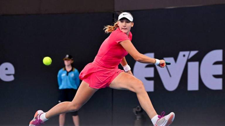 Mirra Andreeva of Russia hits a return during her women's singles quarter-final match against Ons Jabeur of Tunisa at the Brisbane International tennis tournament in Brisbane on January 3, 2025. - AFPPIX