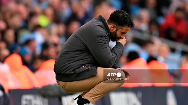 Manchester United's Portuguese head coach Ruben Amorim gestures on the touchline during the English Premier League football match between Manchester City and Manchester United at the Etihad Stadium in Manchester, north west England, on September 14, 2025. - AFP
