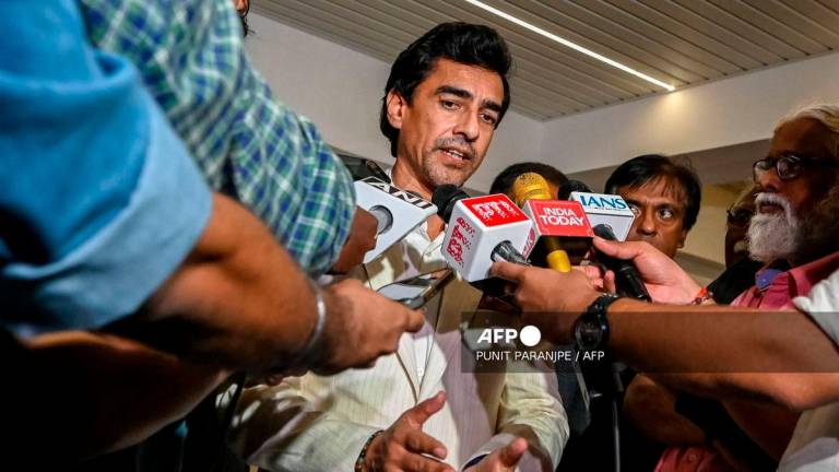 Mithun Manhas, newly elected President of the Board of Control for Cricket in India (BCCI), speaks with media after attending the Annual General Meeting (AGM) at their headquarters in Mumbai on September 28, 2025. (Photo by Punit PARANJPE / AFP)