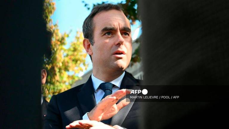 France's Prime Minister Sebastien Lecornu speaks to journalists after a visit to a police station in L'Hay-les-Roses, on the southern outskirts of Paris on October 11, 2025. - POOL via AFP