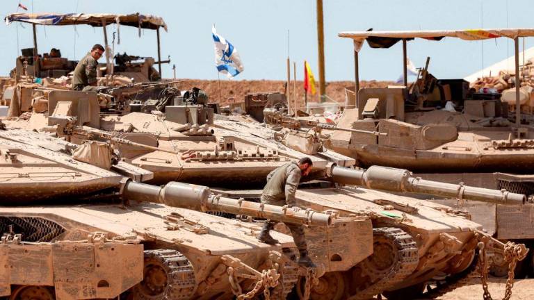 Israeli tanks are positioned along the border with the Gaza Strip on June 5, 2025, amid the ongoing war between Israel and Hamas. Gaza's civil defence agency said Israeli strikes killed at least 10 people in the battered Palestinian territory on June 5 as the military keeps up an intensified offensive. - AFPPIX