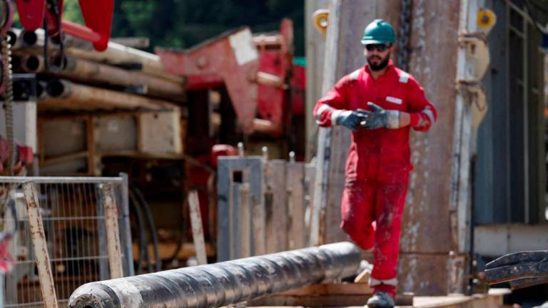 A worker walks next to a drill part during a visit of German Chancellor Olaf Scholz and Bavarian Premier Markus Soeder at a geothermal energy station in Geretsried, Germany, August 24, 2023. - REUTERSPIX