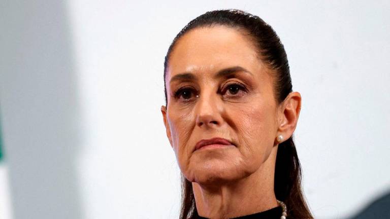 FILE PHOTO: Mexico’s President Claudia Sheinbaum listens to a question during her daily news conference at National Palace, in Mexico City, Mexico, June 25, 2025. REUTERS/Raquel Cunha/File Photo
