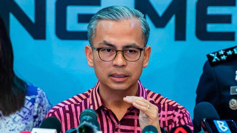 Menteri Komunikasi Datuk Fahmi Fadzil pada sidang media Liputan Sidang Media Sesi Perjumpaan Menteri Komunikasi dan Polis Diraja Malaysia (PDRM) Bersama-sama Pihak TikTok di Menara 1 Bukit Aman, hari ini -fotoBERNAMA