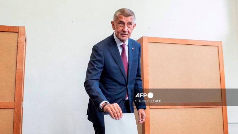 Leader of Czech Republic's ANO party Andrej Babis casts his ballot into an urn during the parliamentary elections at a polling station in Ostrava, Czech Republic on October 3, 2025. - AFP