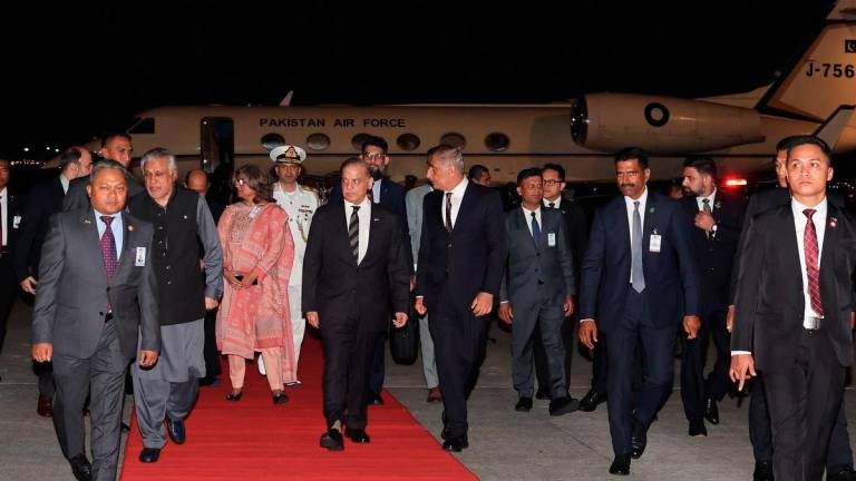 Pakistan Prime Minister Muhammad Shehbaz Sharif (centre) upon arrival at the Bunga Raya Complex, Kuala Lumpur International Airport (KLIA), yesterday to begin his three-day official visit to Malaysia. – BERNAMA