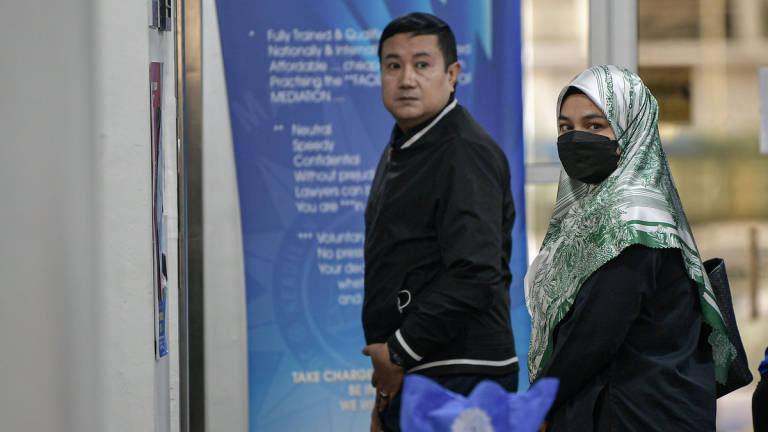 The mother of the late Zayn Rayyan Abdul Matin, Ismanira Abdul Manaf, 30, arrives at the Sessions Court today. – BERNAMA