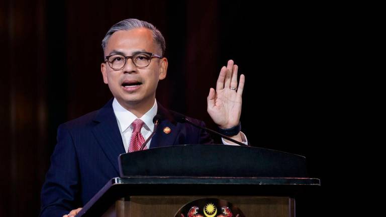 Minister of Communications, Datuk Fahmi Fadzil, delivers a speech at the Opening Ceremony of the 29th Public Service Psychology Conference 2025 at the Seri Angkasa Auditorium today. – BERNAMA
