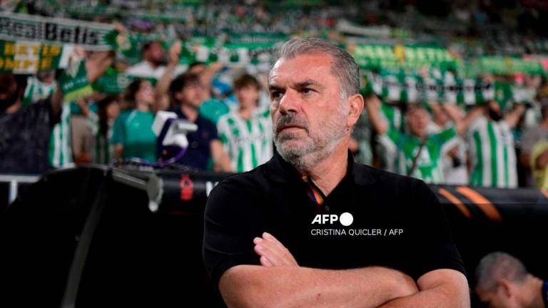 Nottingham Forest's Australian coach Ange Postecoglou looks on prior the UEFA Europa League 1st round day 1 football match between Real Betis and Nottingham Forest at the Benito Villamarin stadium in Seville on September 24, 2025. - AFP