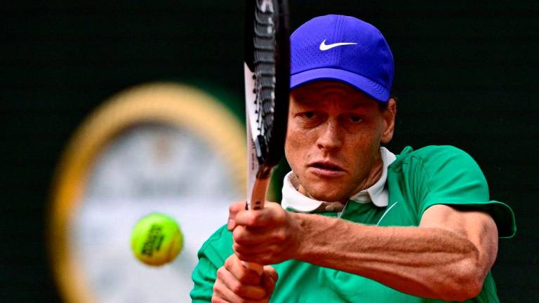 Italy’s Jannik Sinner plays a backhand return to Kazakhstan’s Alexander Bublik during their quarter-final men’s singles match on day 11 of the French Open tennis tournament on Court Philippe-Chatrier at the Roland-Garros Complex in Paris on June 4, 2025. AFP