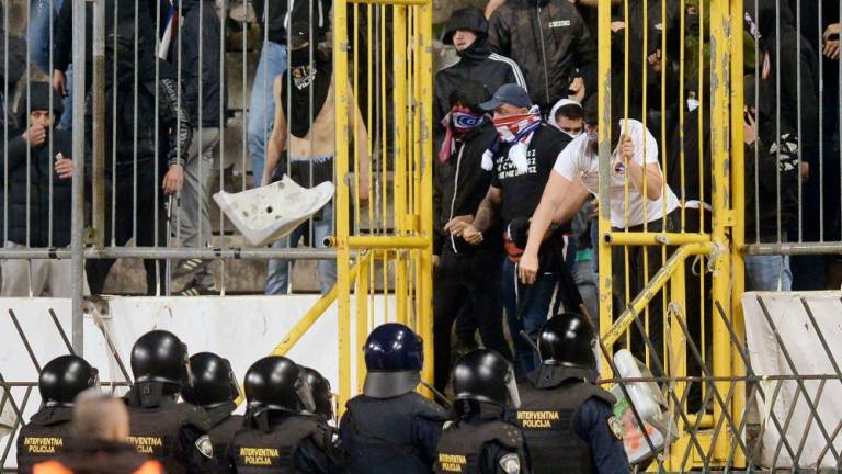 Members of Hajduk Split’s ultra fan base, known as the Torcida, clash with police at the Poljud stadium in Split on April 3, 2024/AFPPix
