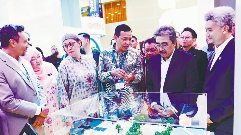 Johari (second, right) visiting the booths after officiating the International Greentech and Eco Products Exhibition and Conference Malaysia 2025 and the Kuala Lumpur Sustainability Summit 2025 at the Kuala Lumpur Convention Centre today. – Bernamapic