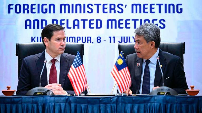 US Secretary of State Marco Rubio takes part in a memorandum of understanding signing with Malaysia’s Minister of Foreign Affairs Mohamad Hasan during the 58th Association of Southeast Asian Nations (ASEAN) Foreign Ministers’ meeting and related meetings at the Convention Centre in Kuala Lumpur on July 10, 2025. (Photo by Mandel NGAN / POOL / AFP)