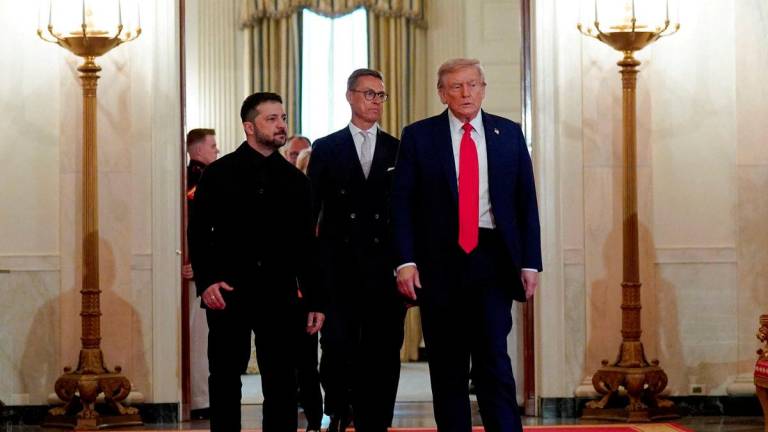 U.S. President Donald Trump, Ukrainian President Volodymyr Zelenskiy and Finland's President Alexander Stubb walk during a meeting, amid negotiations to end the Russian war in Ukraine, at the White House in Washington, D.C., U.S., August 18, 2025. - REUTERSPIX