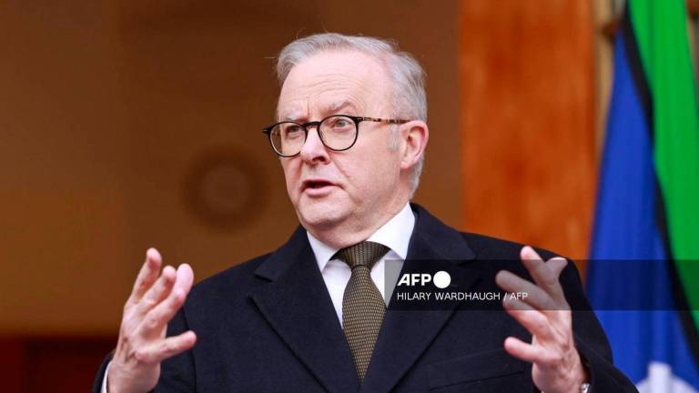 Australia’s Prime Minister Anthony Albanese speaks during a press conference in Canberra on August 11, 2025. (Photo by Hilary Wardhaugh / AFP)