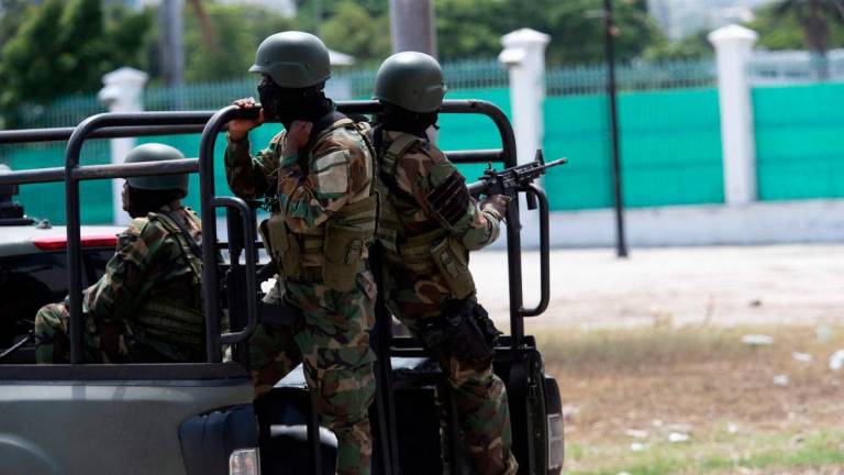 Members of the Haitian armed forces (FADH) patrol the city center near the National Palace in Port-au-Prince on October 1, 2025. (Photo by Clarens SIFFROY / AFP)