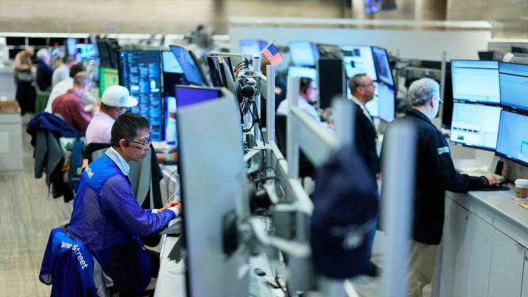 Traders work on the floor of the New York Stock Exchange on July 08, 2025 in New York City. (Photo by Michael M. Santiago / GETTY IMAGES NORTH AMERICA / AFP)