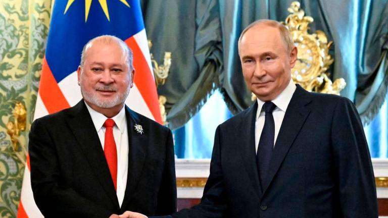 Russian President Vladimir Putin meets with Malaysia’s King Sultan Ibrahim at the Kremlin in Moscow on August 6, 2025. (Photo by Alexander NEMENOV / POOL / AFP)