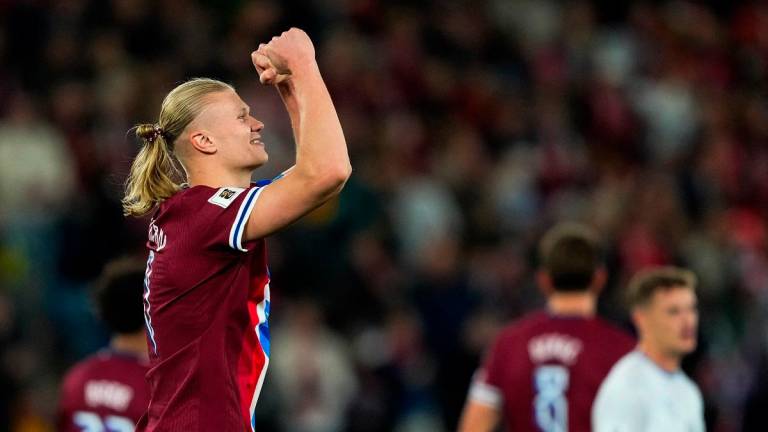 Norway’s forward #09 Erling Braut Haaland (L) celebrates scoring his second goal. - Fredrik Varfjell / NTB / AFP