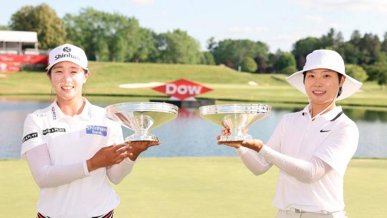 Jin Hee Im (left) and Somi Lee of South Korea pose with their trophies after the final round of the Dow Championship 2025. – GETTY IMAGES