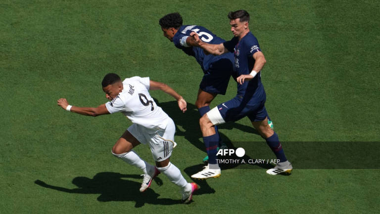 Real Madrid’s French forward #09 Kylian Mbappe fights for the ball with Paris Saint-Germain’s Brazilian defender #05 Marquinhos and Paris Saint-Germain’s Spanish midfielder #08 Fabian Ruiz (L) during the FIFA Club World Cup 2025 semifinal football match between France’s Paris Saint-Germain and Spain’s Real Madrid at MetLife stadium in East Rutherford, New Jersey on July 9, 2025. - AFP