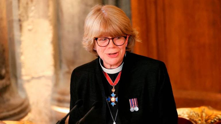 FILE PHOTO: Bishop of London Sarah Mullally speaks during the annual Lord Mayor’s Banquet at Guildhall in London, Britain, December 2, 2024. REUTERS/Mina Kim/File Photo