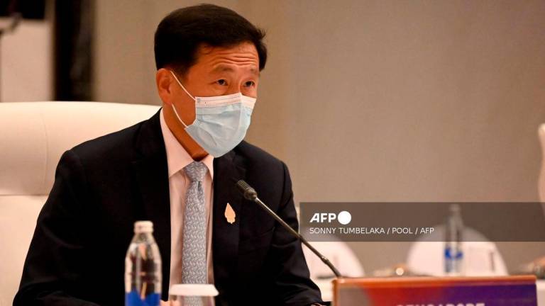 Singapore’s Health Minister Ong Ye Kung - (Photo by SONNY TUMBELAKA / POOL / AFP)
