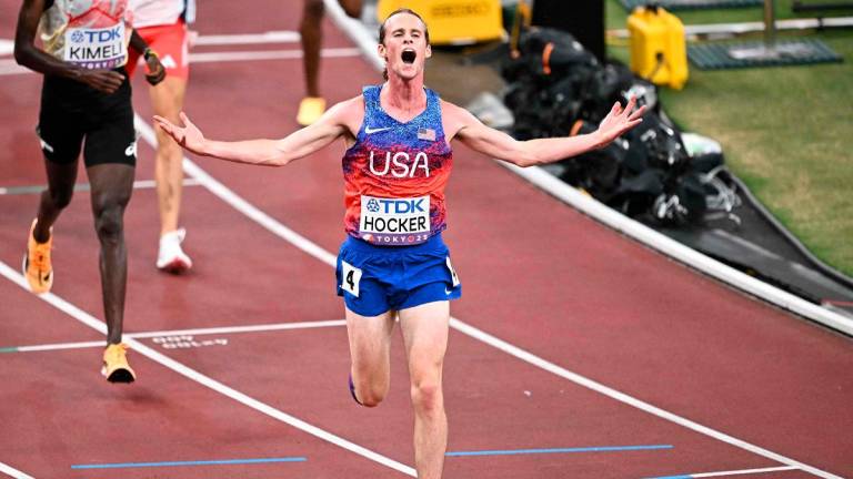 US’ athlete Cole Hocker celebrates winning the men’s 5000m final during the World Athletics Championships in Tokyo on September 21, 2025. - Philip FONG / AFP