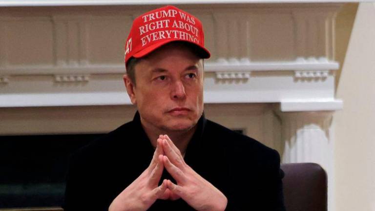 FILEpix: Tesla CEO Elon Musk wears a ‘Trump Was Right About Everything!’ hat while attending a cabinet meeting at the White House, in Washington, D.C., U.S., March 24, 2025. REUTERSpix
