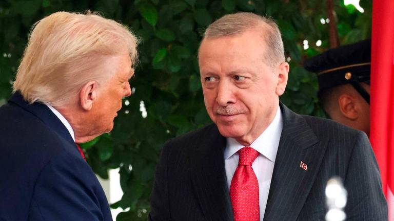 U.S. President Donald Trump welcomes Turkey’s President Recep Tayyip Erdogan at the White House in Washington, D.C., U.S., September 25, 2025. REUTERS/Kevin Lamarque/File Photo