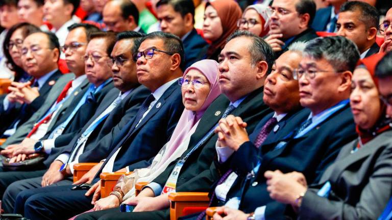 The prime minister’s wife Datuk Seri Dr Wan Azizah Wan Ismail, Transport Minister Anthony Loke, Home Minister Datuk Seri Saifuddin Nasution Ismail and Malaysian delegates listening to Anwar’s lecture at the university yesterday. – BERNAMAPIC