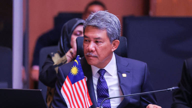 Malaysia's Minister of Foreign Affairs Mohamad Hasan attends the Association of Southeast Asian Nations (ASEAN) Post-Ministerial Conference with the United Kingdom during the 58th ASEAN Foreign Ministers’ meeting and related meetings at the Convention Centre in Kuala Lumpur on July 11, 2025. - Pool via AFP