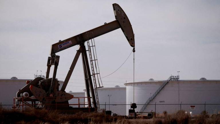FILE PHOTO: A pump jack operates near a crude oil reserve in the Permian Basin oil field near Midland, Texas, U.S. February 18, 2025. REUTERS/Eli Hartman/File Photo