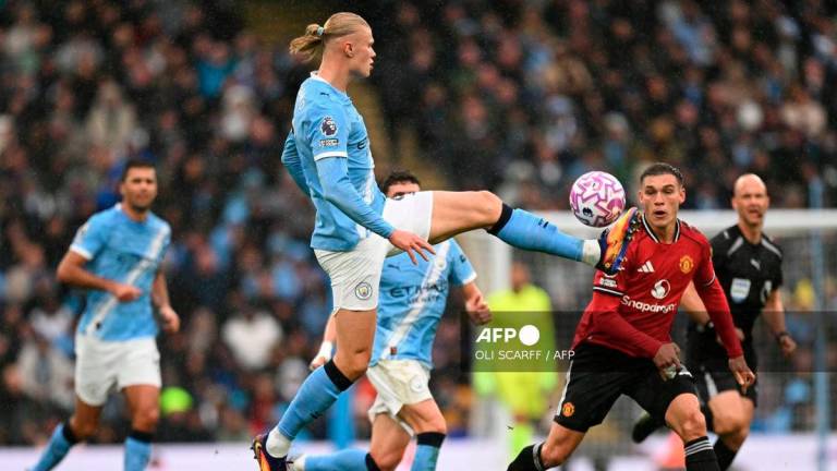 Manchester City's Norwegian striker #09 Erling Haaland controls the ball during the English Premier League football match between Manchester City and Manchester United at the Etihad Stadium in Manchester, north west England, on September 14, 2025. - AFP