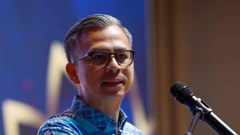 Communications Minister Datuk Fahmi Fadzil - Photo by BERNAMA