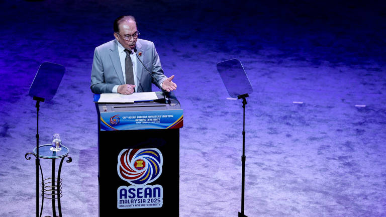 Prime Minister Datuk Seri Anwar Ibrahim delivers his keynote address at the opening ceremony of the 58th ASEAN Foreign Ministers’ Meeting (AMM) and related meetings at the Kuala Lumpur Convention Centre yesterday. - BERNAMA