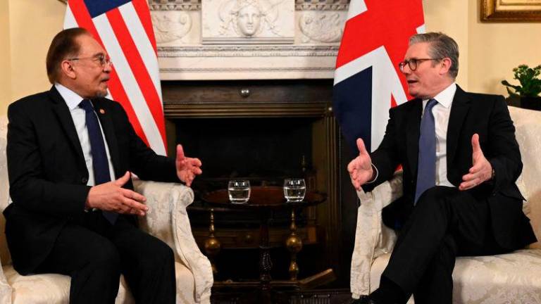 Prime Minister Datuk Seri Anwar Ibrahim (left) with UK Prime Minister Keir Starmer - AFPpix