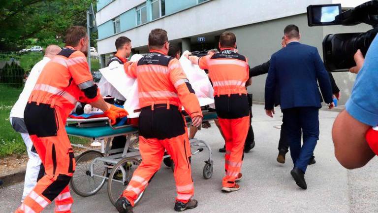 Picture taken on May 15, 2024 shows Slovak Prime Minister Robert Fico being transported by medics and his security detail to the hospital in Banska Bystrica, Slovakia where he is to be treated after he had been shot multiple times - AFPPIX