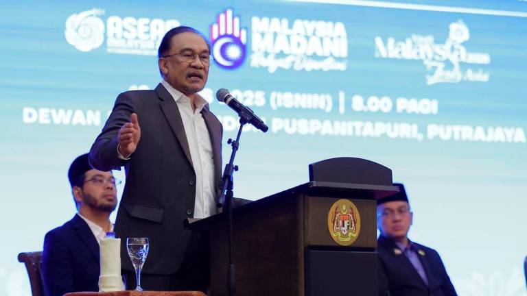 Prime Minister Datuk Seri Anwar Ibrahim delivers a speech during the Prime Minister’s Gathering with Staff of the Prime Minister’s Department for the month of August at Puspanitapuri today. – BERNAMA