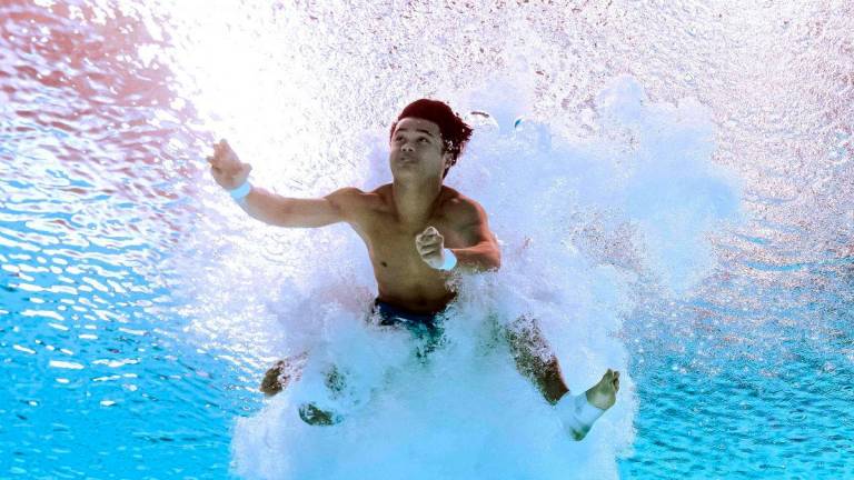 Malaysia's diver Elvis Priestly Anak Clement competes in the final of the men's 10m platform diving event during the 2025 World Aquatics Championships in Singapore on August 2, 2025. - AFPPIX