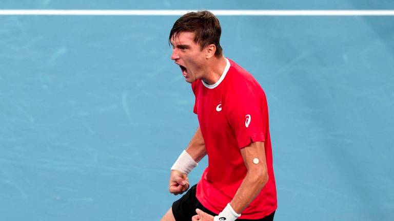 Belgium’s Raphael Collignon reacts after defeating Australia’s Alex de Minaur during the Davis Cup second-round qualifier tennis match at Ken Rosewall Arena in Sydney on September 13, 2025. - AFPPIX