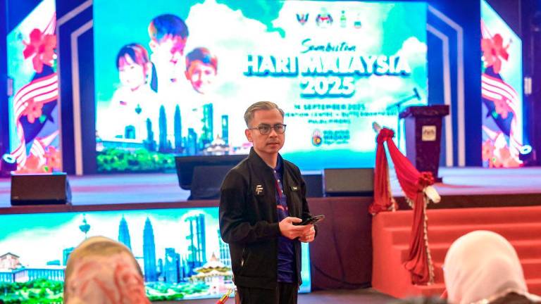 Communications Minister Datuk Fahmi Fadzil inspecting the full rehearsal in preparation for the 2025 Malaysia Day celebrations at the PICCA Convention Centre @ Arena Butterworth last night. - BERNAMA
