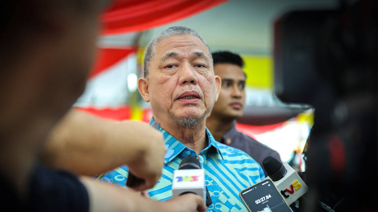 Deputy Prime Minister Datuk Seri Fadillah Yusof speaks to reporters after officiating the Kuching branch of He Medical Clinic and the Men’s Health Exhibition today. – BERNAMA