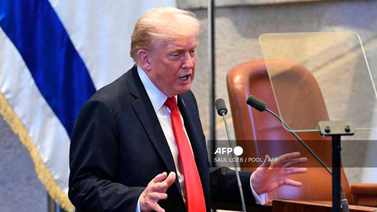 US President Donald Trump addresses the Israeli parliament, the Knesset, in Jerusalem on October 13, 2025. - POOL via AFP