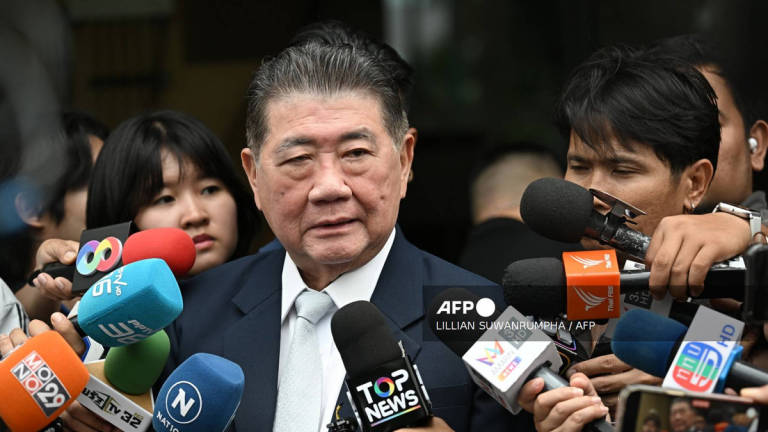 Thailand new acting Prime minister Phumtham Wechayachai speaks to media after a cabinet meeting at Government House in Bangkok on July 3, 2025. - AFP