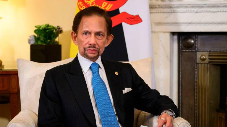 Brunei’s Sultan Hassanal Bolkiah holds a meeting with Britain’s Prime Minister Keir Starmer inside 10 Downing Street in central London, on December 19, 2024. (Photo by Leon Neal / POOL / AFP)